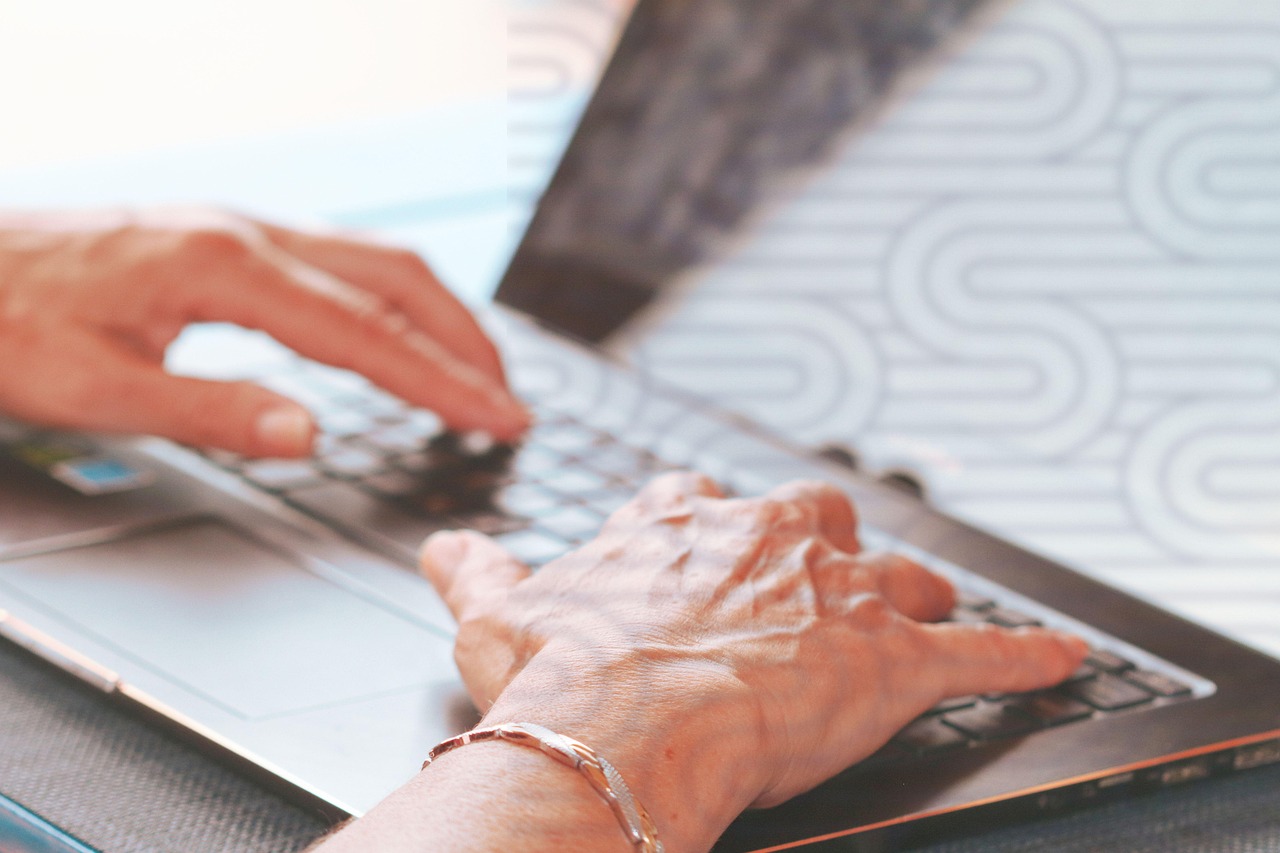man using laptop for online verification